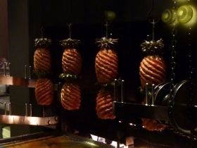 Pineapples rotate on an 18th century meat roasting mechanism, neatly summarising Dinner's theme