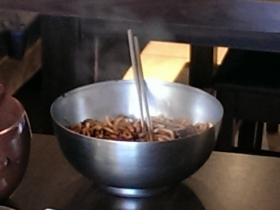 Black bean noodles prepared in a shiny bowl