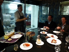 Jason the pastry chef takes us through the puds, the kitchen busy behind him